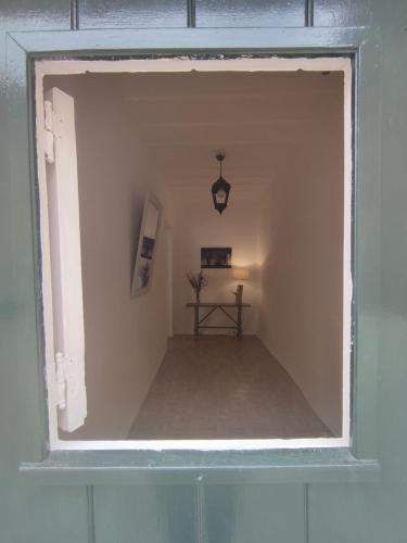 a window in a room with a table in it at Historic Torres Vedras in Torres Vedras