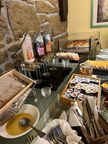 a buffet with many different types of food on a counter at Rainbow Hotel Depandance Joli in San Marino