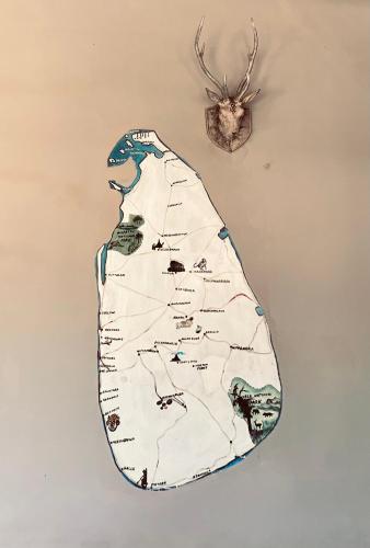 a drawing of a whale on a wall at Sun Shine Guest House in Negombo