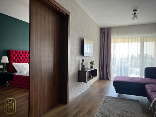 a room with a bedroom with a bed and a window at MM Residence in Cluj-Napoca
