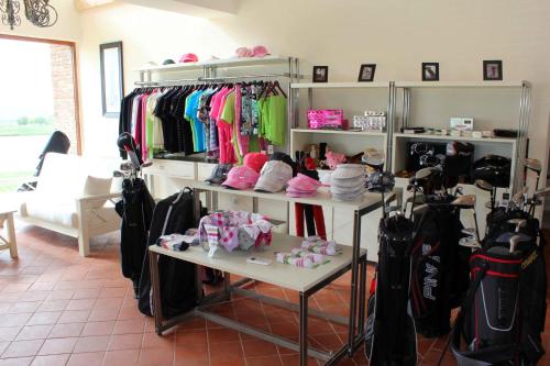 a room filled with shelves filled with clothes at Ambassadori Kachreti Golf Resort in Kachretʼi