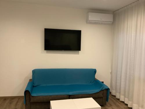 TV a/nebo společenská místnost v ubytování Albergo Cappello e Cadore