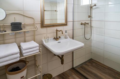 a bathroom with a sink and a shower at Apartmán Nad Modravou in Modrava