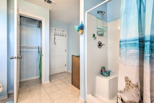 a bathroom with a shower and a glass door at Coden Vacation Rental with Bay Access! in Coden