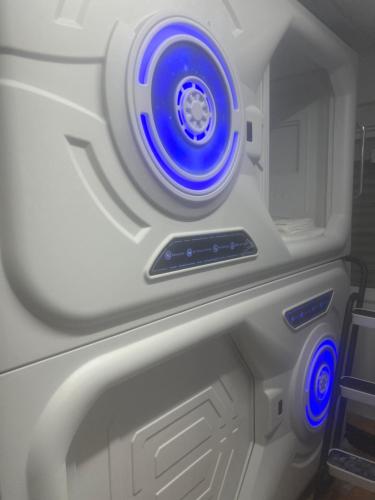 an autonomous vehicle with blue lights on it at Limin Hostel Capsules in Valencia