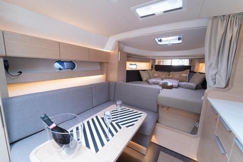 a view of the inside of a motor yacht with a table at Le 4 Stagioni Dante's Suites H Napoli Centro, by ClaPa Group in Naples