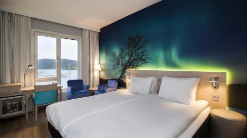 En eller flere senger på et rom på Thon Hotel Nordlys