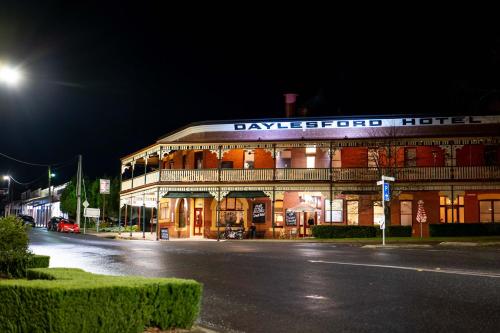 a large building on a street at night at The Daylesford Hotel in Daylesford