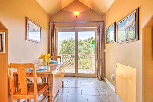 a dining room with a table and a window at Romantic YosemiteandBass Lake Retreat with Mtn Views! in North Fork