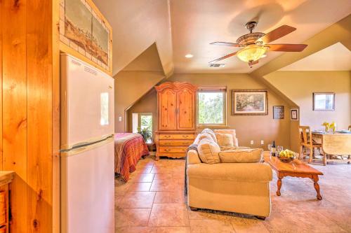 a living room with a couch and a refrigerator at Romantic YosemiteandBass Lake Retreat with Mtn Views! in North Fork