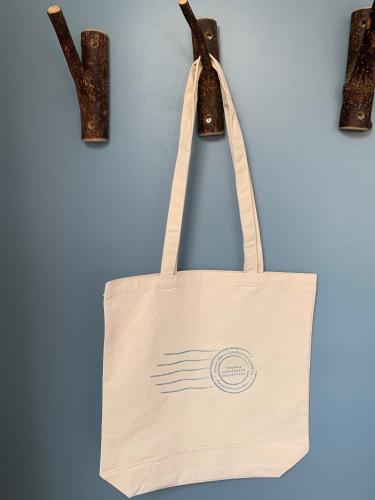 a tote bag hanging on a wall at Appartement 't Loft in Zandvoort
