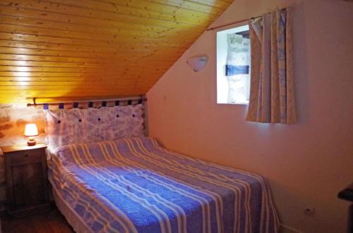 Tempat tidur dalam kamar di Cherveix