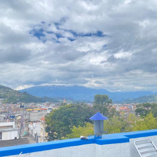 a view from the roof of a building with a city at Hostal Chasqui in Otavalo