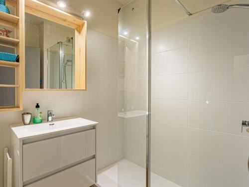 a white bathroom with a shower and a sink at Appartement Hendaye, 2 pièces, 4 personnes - FR-1-2-309 in Hendaye