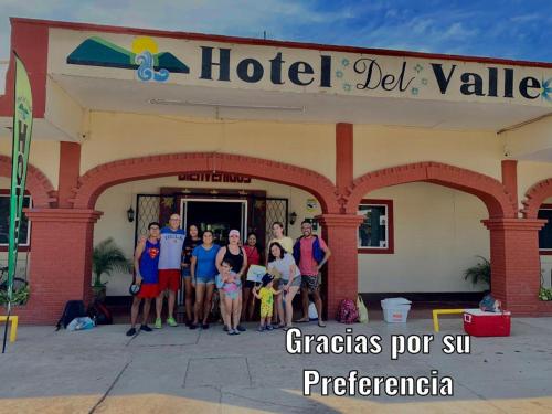 a group of people standing in front of a hotel at Hotel Del Valle in El Naranjo
