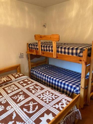 a room with two bunk beds in a room at Casina dei Nonni in Pietracamela