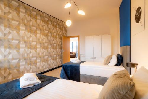 Posteľ alebo postele v izbe v ubytovaní Penthouse Cracow