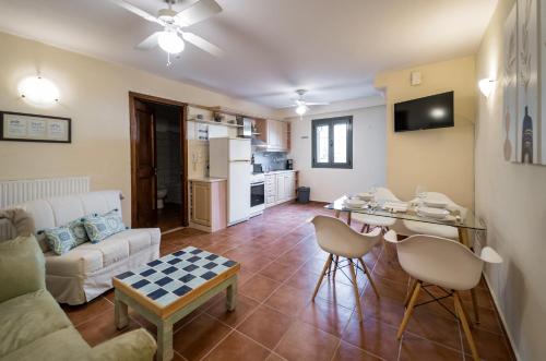 a living room with a couch and a table at Sant'Agata in Lixouri
