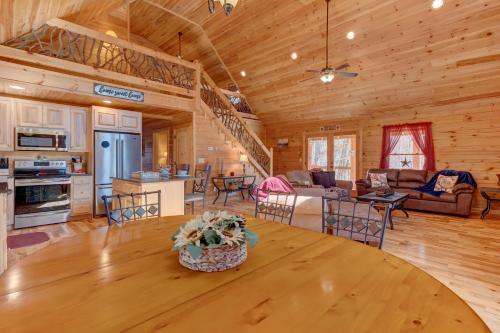 a kitchen and living room with a table in a cabin at Relax & Unwind Hot-Tub 6 seater, Fire-Pit, Master King Bed, Near Wineries, Resort Amenities in Ellijay