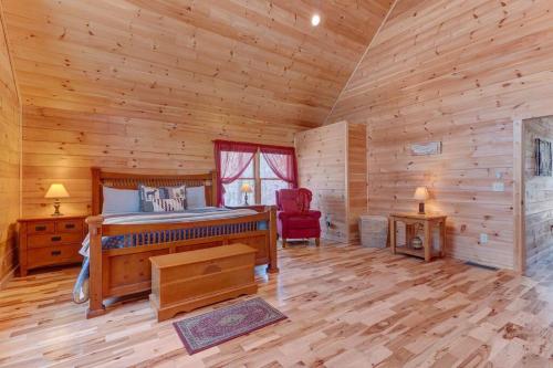 a bedroom with a bed in a log cabin at Hot-Tub Fire-Pit WineCountry Gym IndoorHeatedPool GasGrill in Ellijay