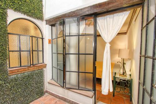 an open door to a room with ivy at Hotel Real Guanajuato in Guanajuato