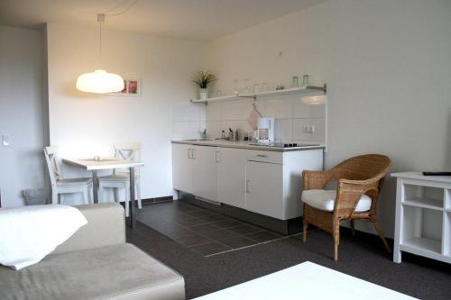 A kitchen or kitchenette at Kastanienhof Apartment und Restaurant