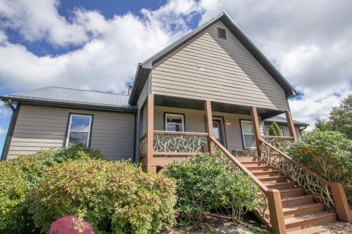 a house with a porch and stairs in front of it at Ace of Diamonds in Seven Devils