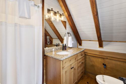 a bathroom with a sink and a toilet at Almost Heaven in Boone
