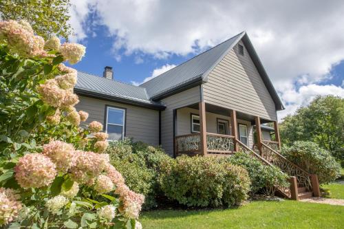 a house with flowers in front of it at Ace of Diamonds in Seven Devils