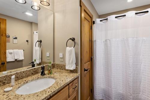 a bathroom with a sink and a shower at Almost Heaven in Boone