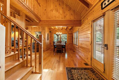 a dining room in a log home with a table at Almost There in Blowing Rock
