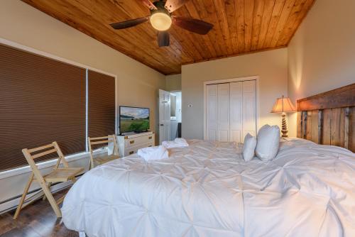 a bedroom with a large bed and a ceiling fan at Appalachian Mountain Lodge in Boone