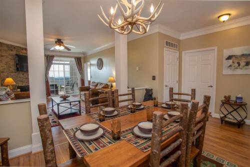 a dining room and living room with a table and chairs at Bear Necessities in Beech Mountain