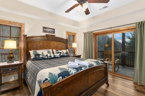 a bedroom with a large bed and a window at Bearfoot Lodge in Banner Elk