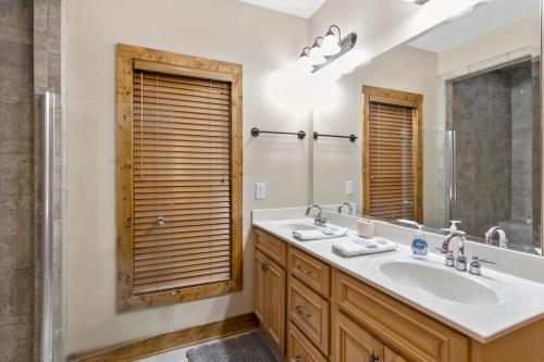 a bathroom with a sink and a mirror at Bearfoot Lodge in Banner Elk