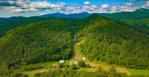 an aerial view of a mountain valley with trees at Breathe Easy in Vilas