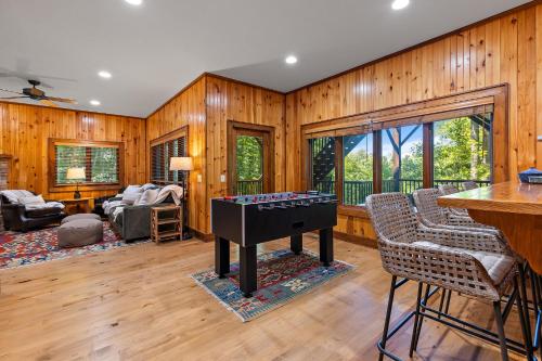 a living room with a ping pong table at Chimney Island in Blowing Rock