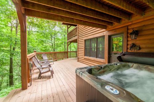 a hot tub on the deck of a cabin at Creek Sound Chalet in Blowing Rock