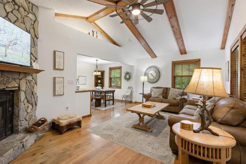 a living room with a couch and a fireplace at Fehrway to Heaven in Blowing Rock