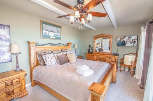 a bedroom with a bed and a ceiling fan at Four Diamond Escape in Seven Devils