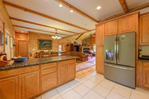 a large kitchen with wooden cabinets and a large island at Fox Crossing in Banner Elk