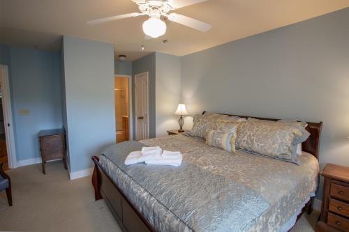 a bedroom with a bed and a ceiling fan at Havens Rest in Valle Crucis