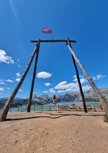 a person on a swing at the beach at Hostal Sainz in Riaño
