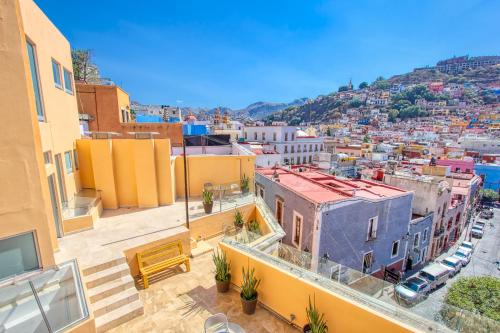 a view of a city from a building at Hotel Real Guanajuato in Guanajuato