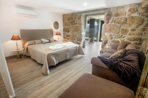 Ένα ή περισσότερα κρεβάτια σε δωμάτιο στο Casas de Tourim