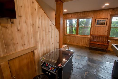 a room with wooden walls and a pin bowling exhibit at Serendipity in Blowing Rock