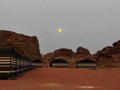 a group of tunnels in a desert with rocks at Wadi Rum Desert Adventures in Wadi Rum