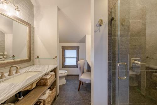 a bathroom with a shower and a sink and a toilet at Spice Ridge Retreat in Seven Devils