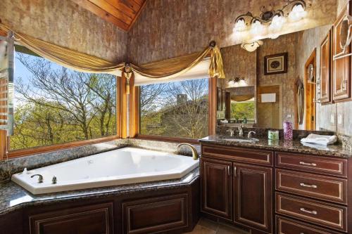a bathroom with a large tub and a window at Sunset Beech in Beech Mountain