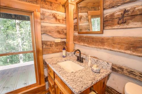 a bathroom with a sink and a mirror at The Berry Patch in Blowing Rock